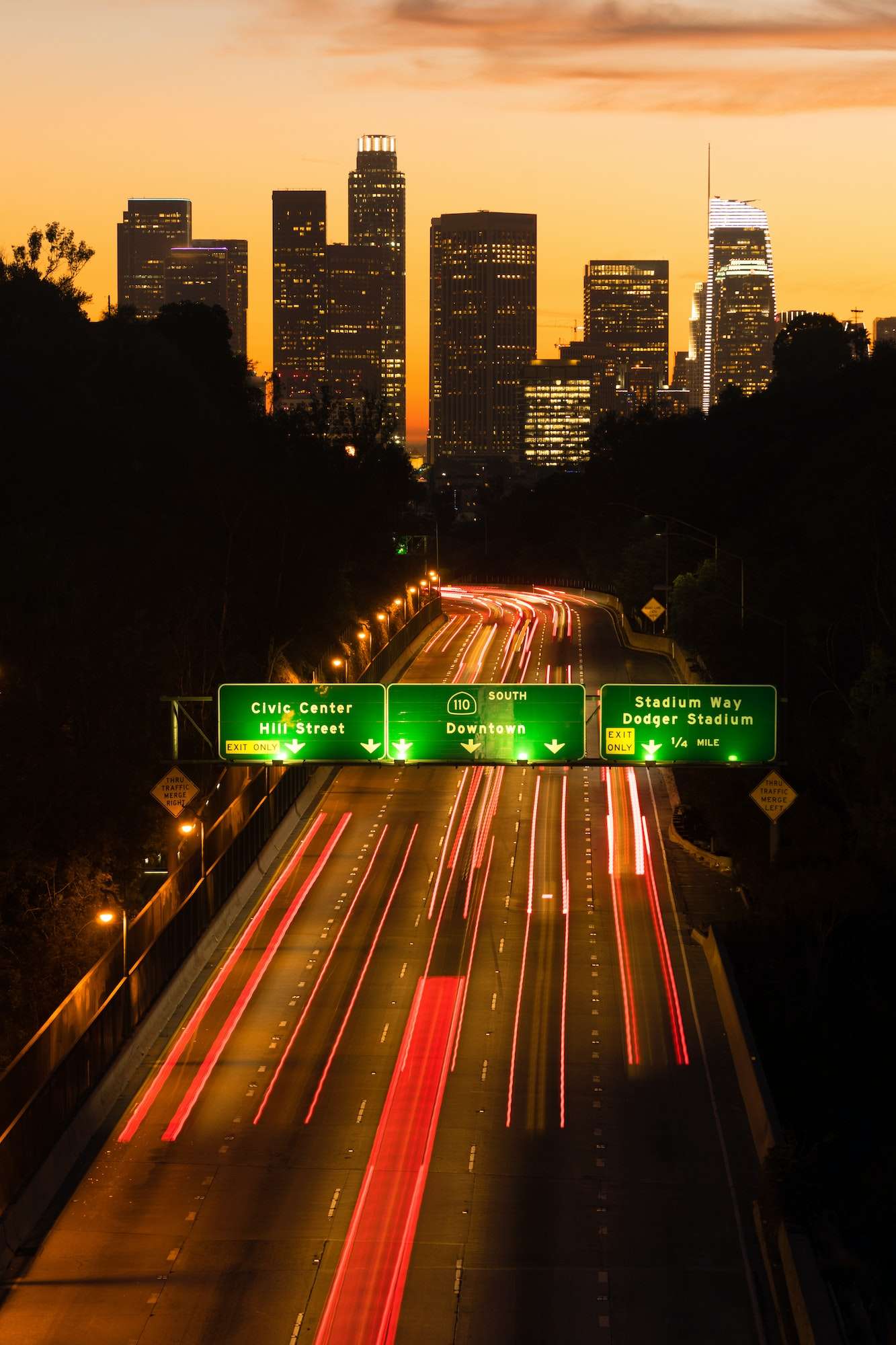 interstate-highway-110-leads-commuters-into-los-angeles-at-sunset